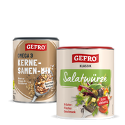 Zwei GEFRO Dosen mit Kernesamen-Mix und Salatwürze, nebeneinander als Produktbild vor weißem Hintergrund