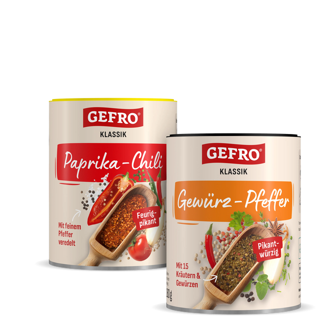 Zwei GEFRO Klassik Gewürzdosen mit Paprika-Chili und Gewürz-Pfeffer, freigestellt vor schwarzem Hintergrund