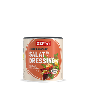Dose GEFRO Amore Pomodore Salat Dressing mit orangefarbenem Etikett und Salatabbildung auf schwarzem Hintergrund