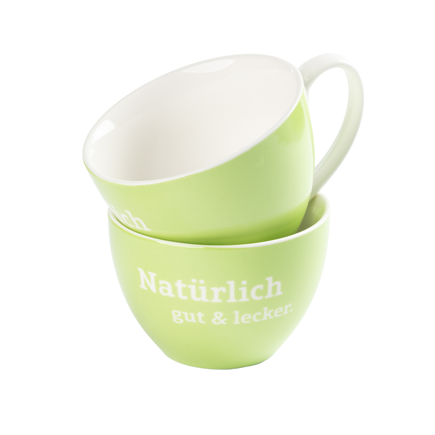 Zwei hellgrüne Tassen, eine schräg in der anderen gestapelt, mit weißem Innenraum und Aufdruck „Natürlich gut & lecker“