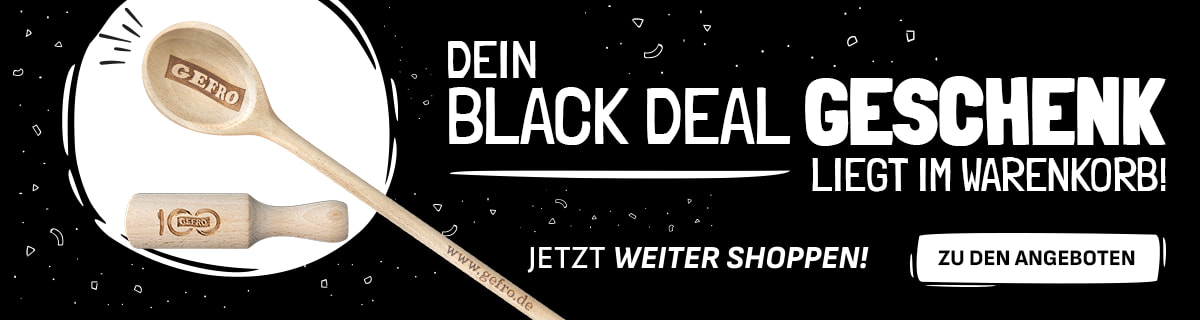 Werbebanner mit schwarzem Hintergrund und weißer Schrift: „Dein Black Deal Geschenk liegt im Warenkorb! Jetzt weiter shoppen!“. Links sind ein hölzerner Kochlöffel mit Gravur „GEFRO“ und ein hölzernes Nudelholz mit Jubiläumsgravur abgebildet. Rechts ein weißer Button mit der Aufschrift „Zu den Angeboten“