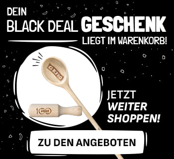 Werbebanner mit schwarzem Hintergrund und weißer Schrift: „Dein Black Deal Geschenk liegt im Warenkorb! Jetzt weiter shoppen!“. Links sind ein hölzerner Kochlöffel mit Gravur „GEFRO“ und ein hölzernes Nudelholz mit Jubiläumsgravur abgebildet. Rechts ein weißer Button mit der Aufschrift „Zu den Angeboten“