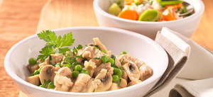 Putenfricassee mit Erbsen und Champignons